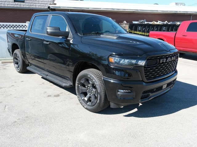 2026 RAM 1500 Express in Diamond Black Crystal Pearl-Coat Exterior Paint — front three-quarter view